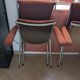 Pair of vintage folding chairs in terracotta fabric.