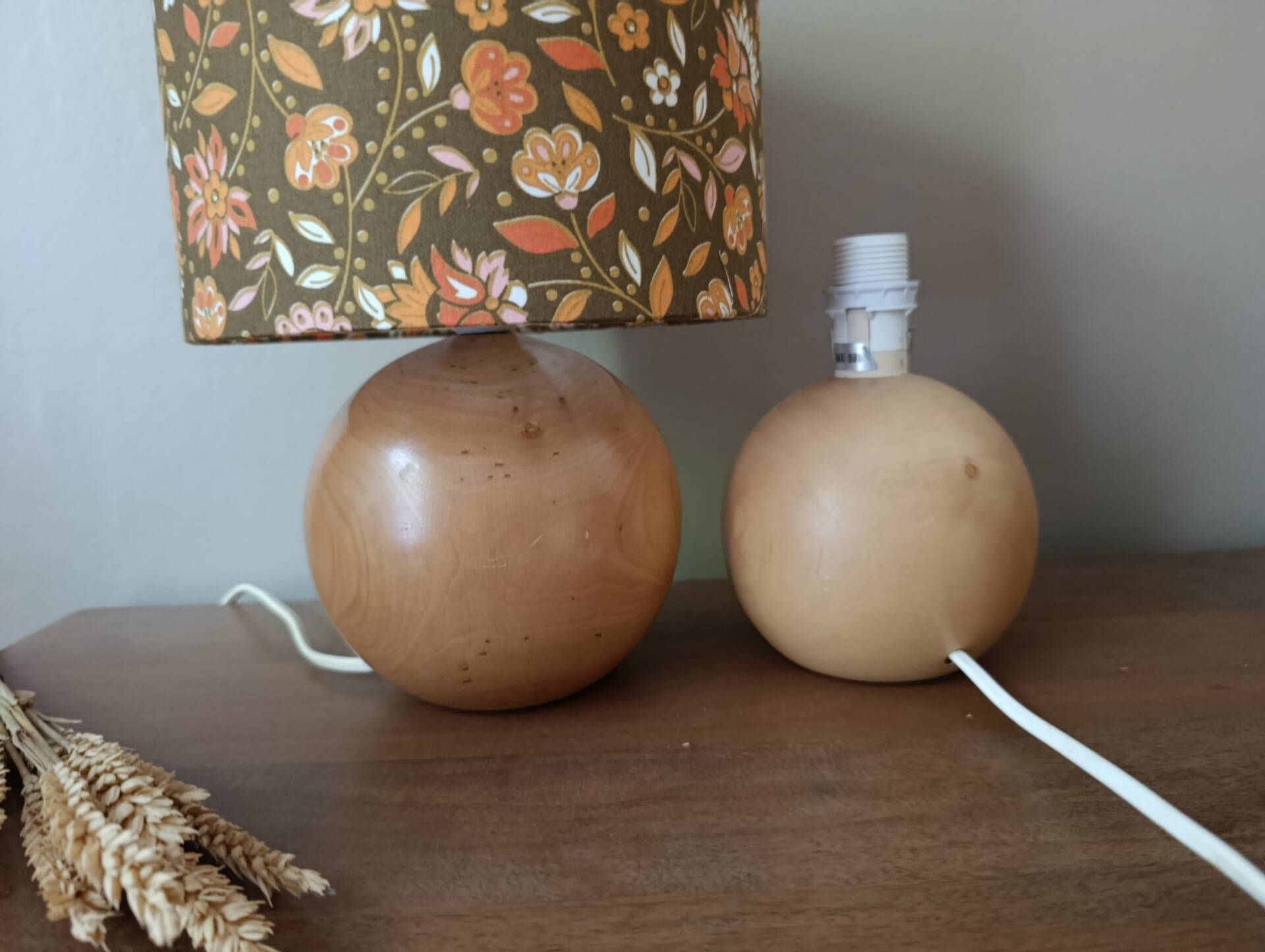 Table lamp with a wooden ball base, floral print in bohemian style.