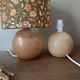 Table lamp with a wooden ball base, floral print in bohemian style.