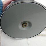 Red glass table lamp on a chrome base.