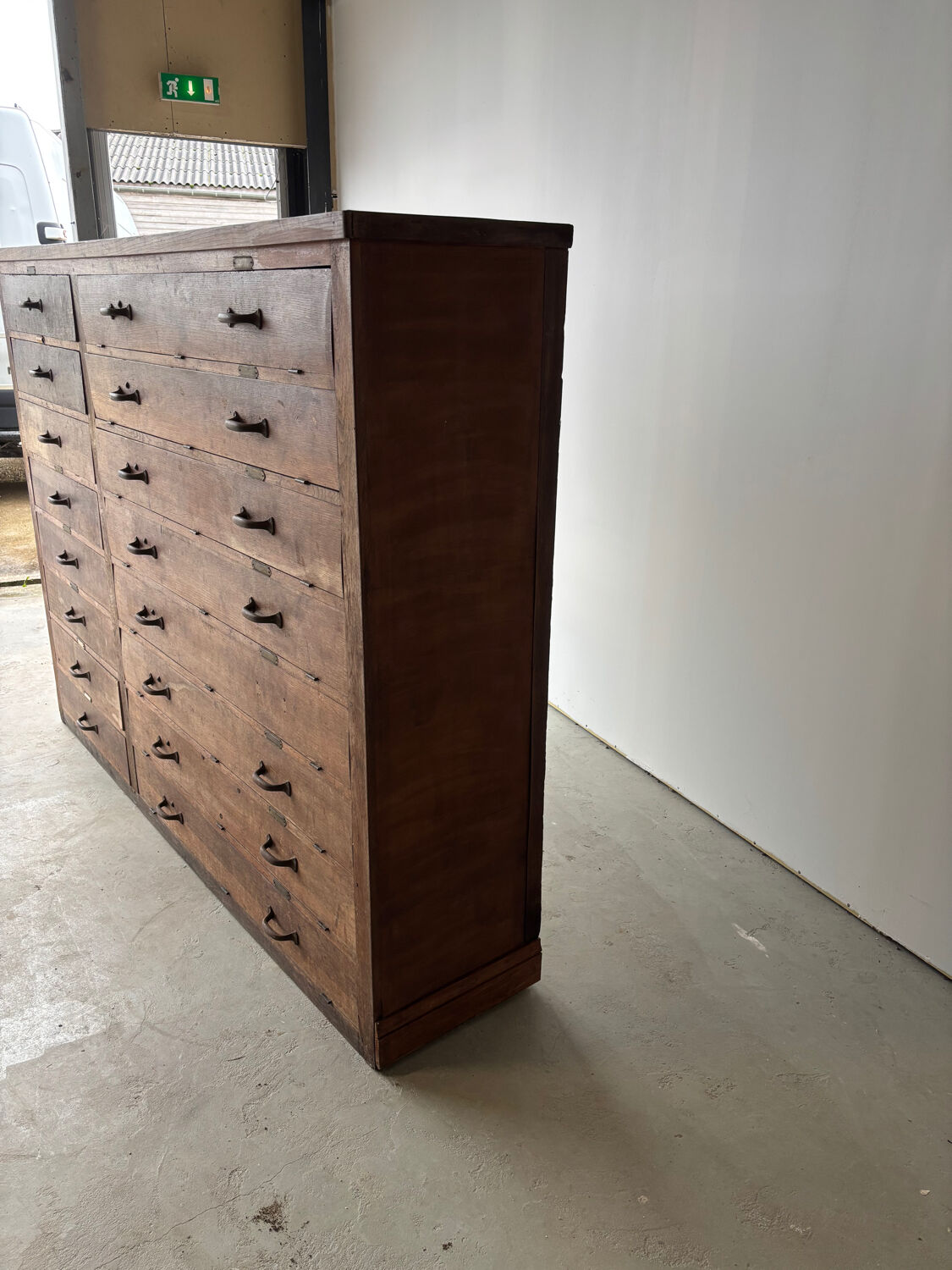 Large wooden workshop cabinet with 16 drawers, antique from the early 1900s.