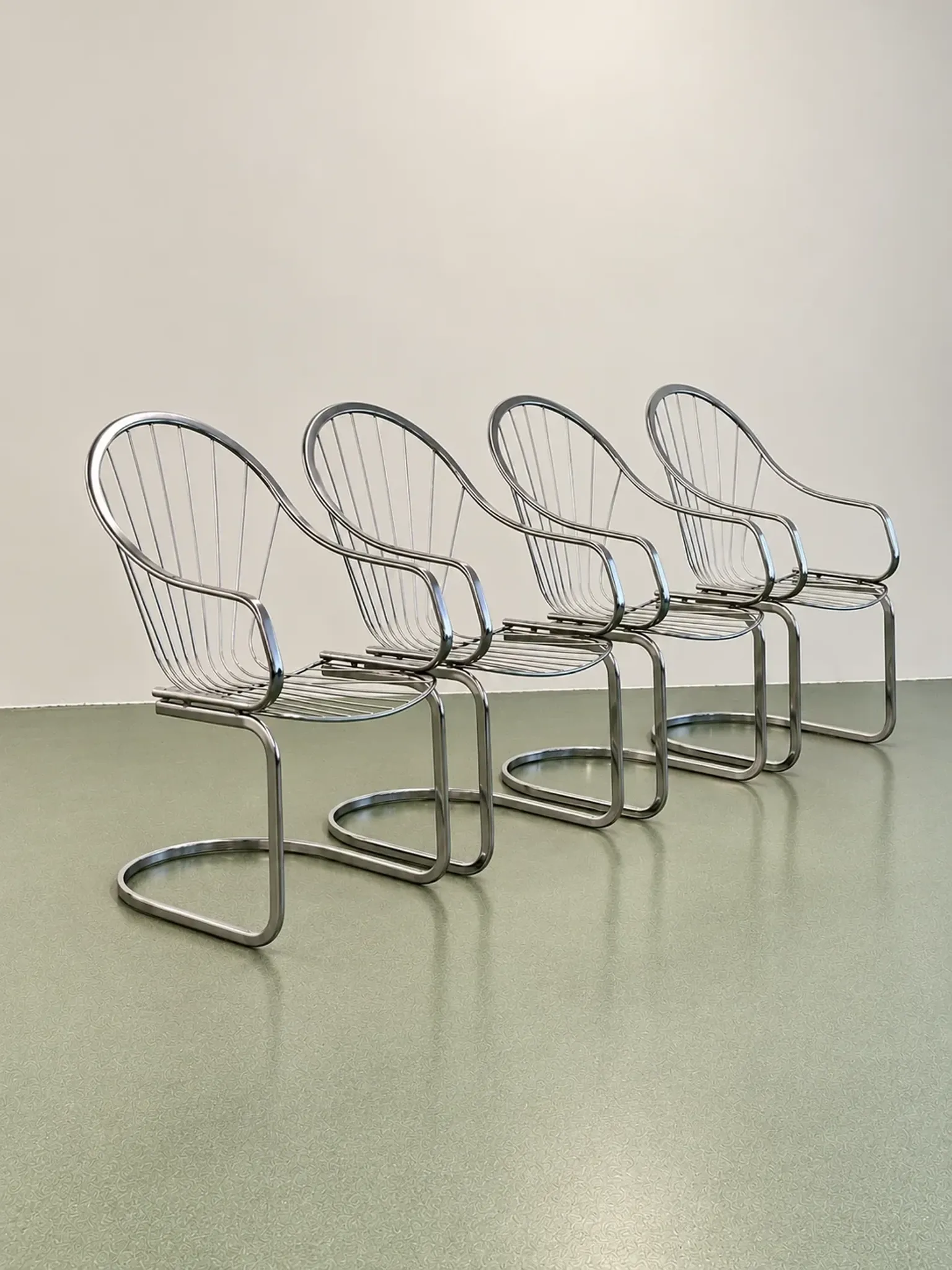 Set of four chrome cantilever dining chairs, 1970s