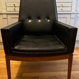 Modernist armchair in wood and black synthetic leather, circa 1960