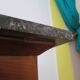 Empire/Restoration style console table with scrolled ends, mirrored back, and claw feet.
