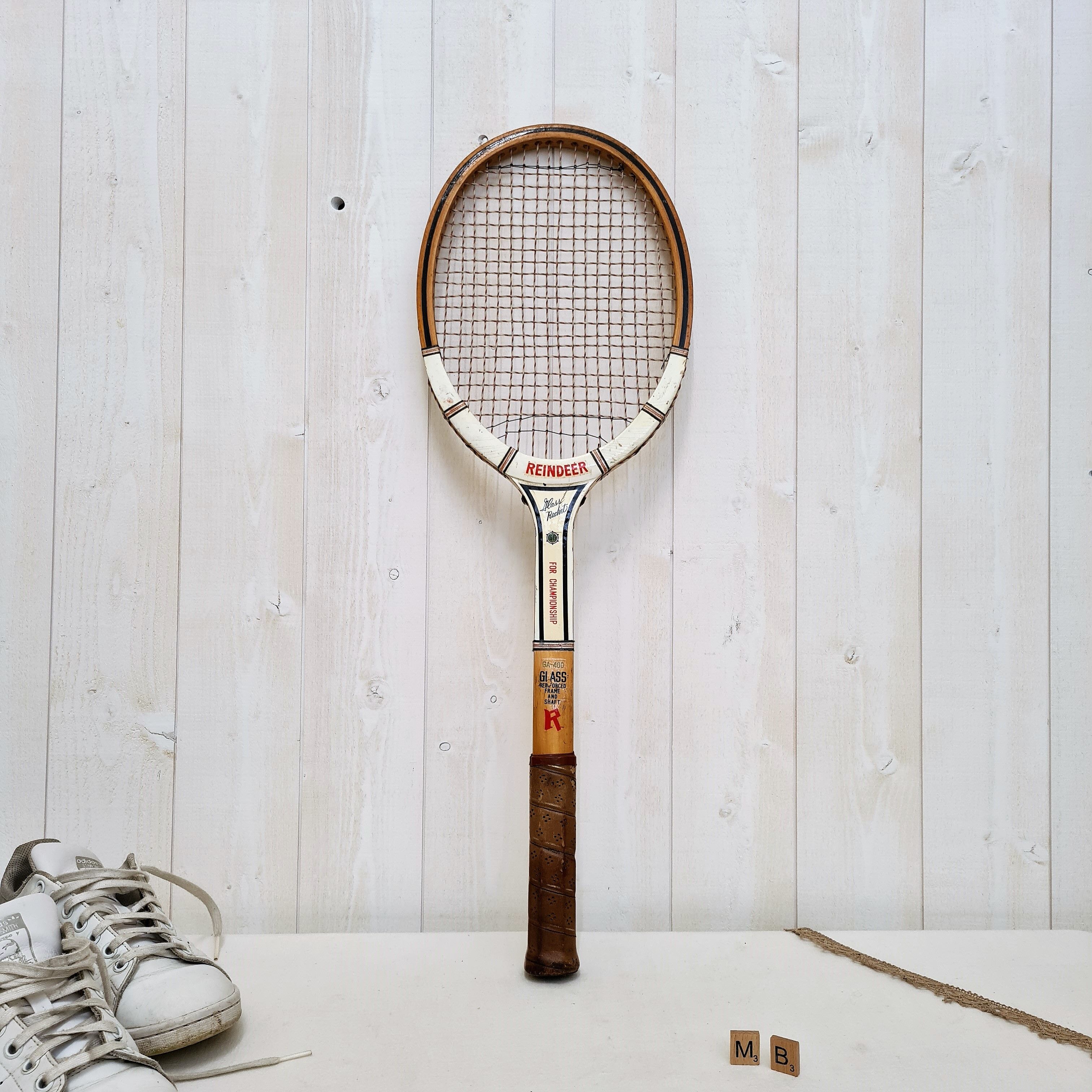 Vintage tennis racket with wooden press