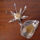 Individual ashtrays on decorative metal flower