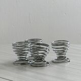 4 stainless steel egg cups.
