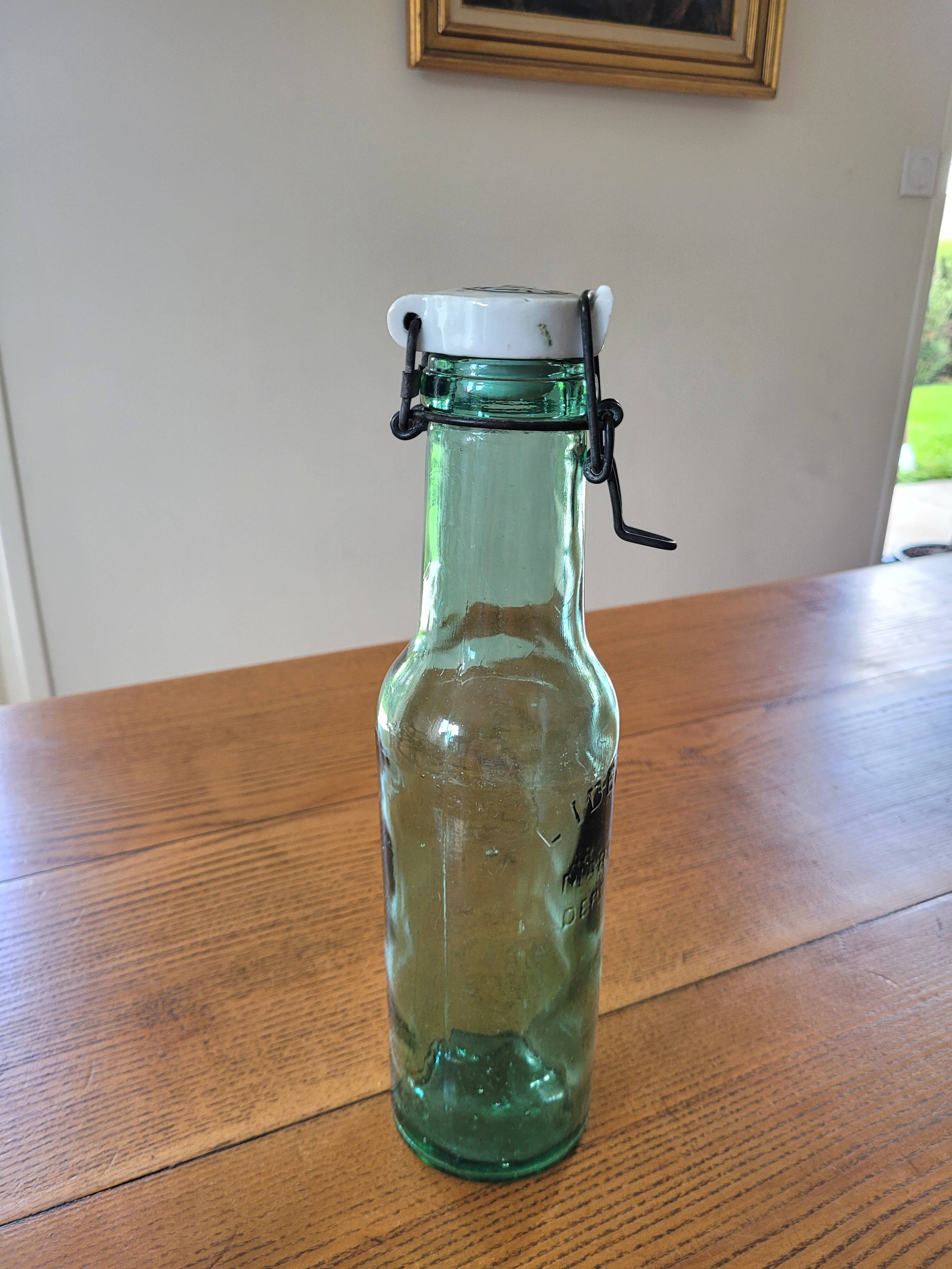 Vintage glass bottle l'Idéale with porcelain stopper