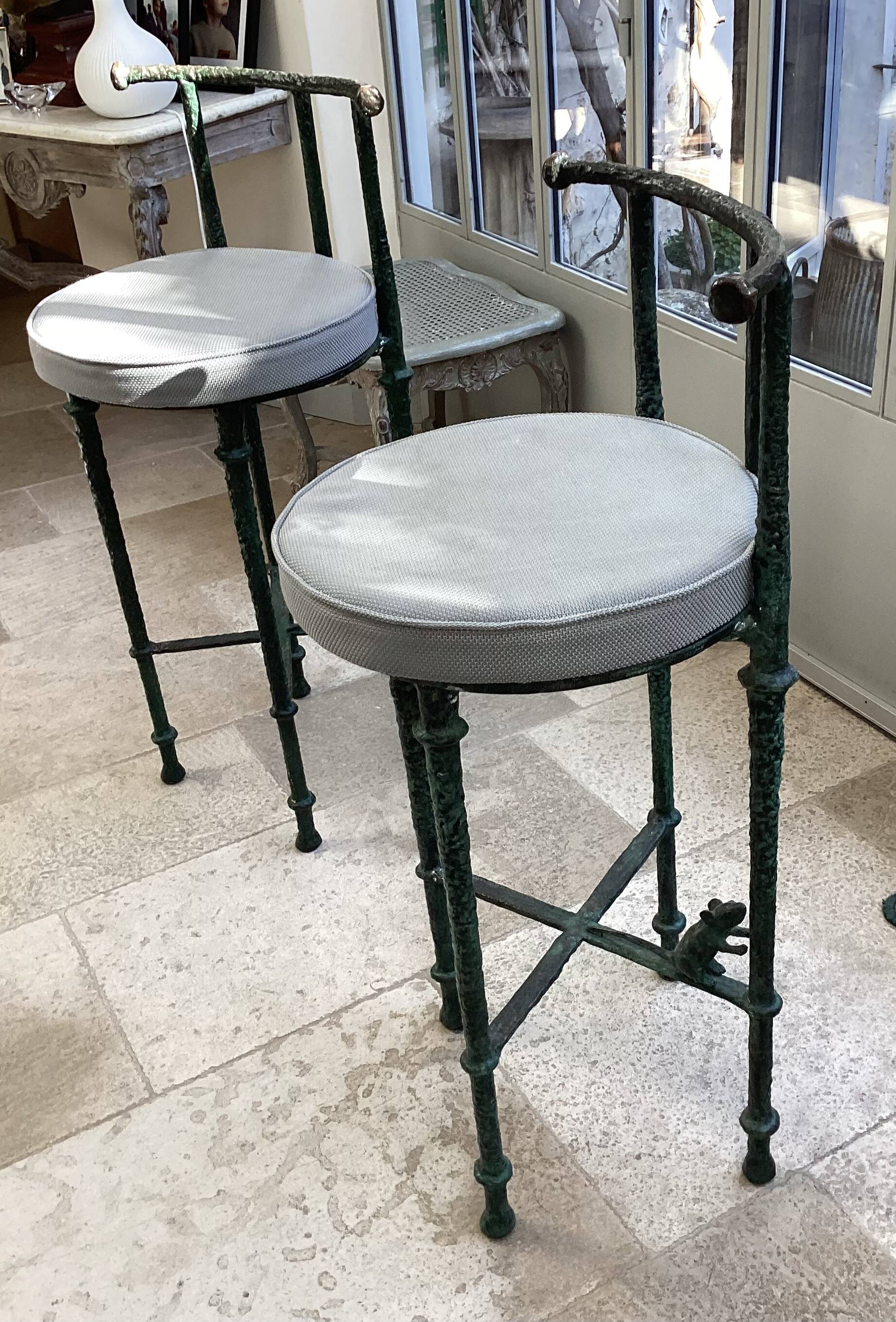 Pair of patinated bronze stools in the spirit of Giacometti.