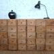 Industrial or apothecary workbench with 30 vintage wooden drawers.