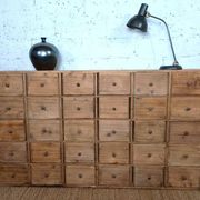 Industrial or apothecary workbench with 30 vintage wooden drawers.