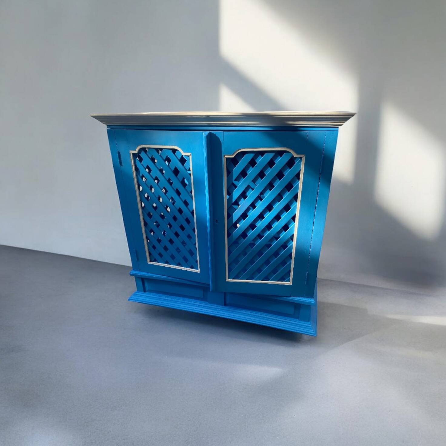 Large colonial style wooden cabinet with latticework