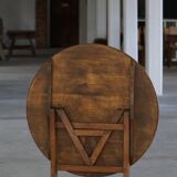 19th-century French round wine table with an adjustable top and floral textile surface.