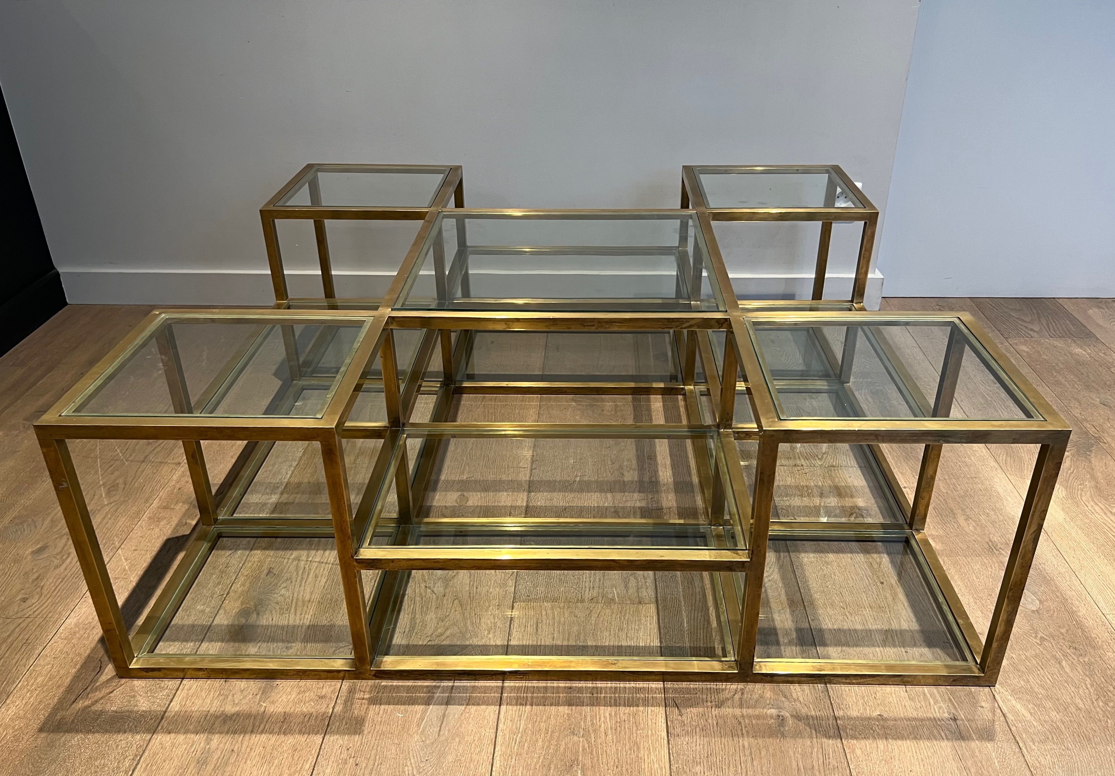 Important brass coffee table with multiple levels.