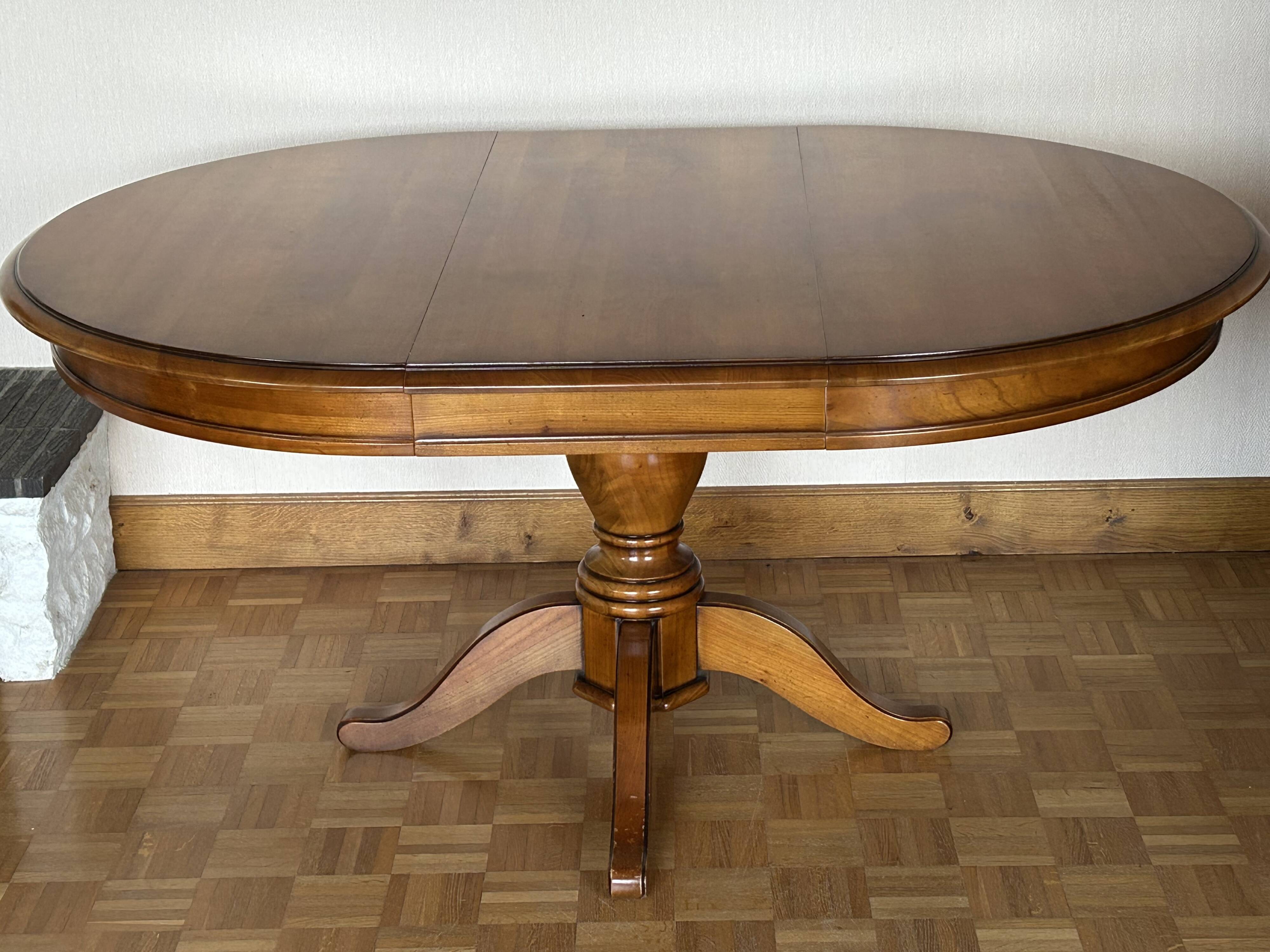 Louis Philippe solid cherry table with 2 extensions.