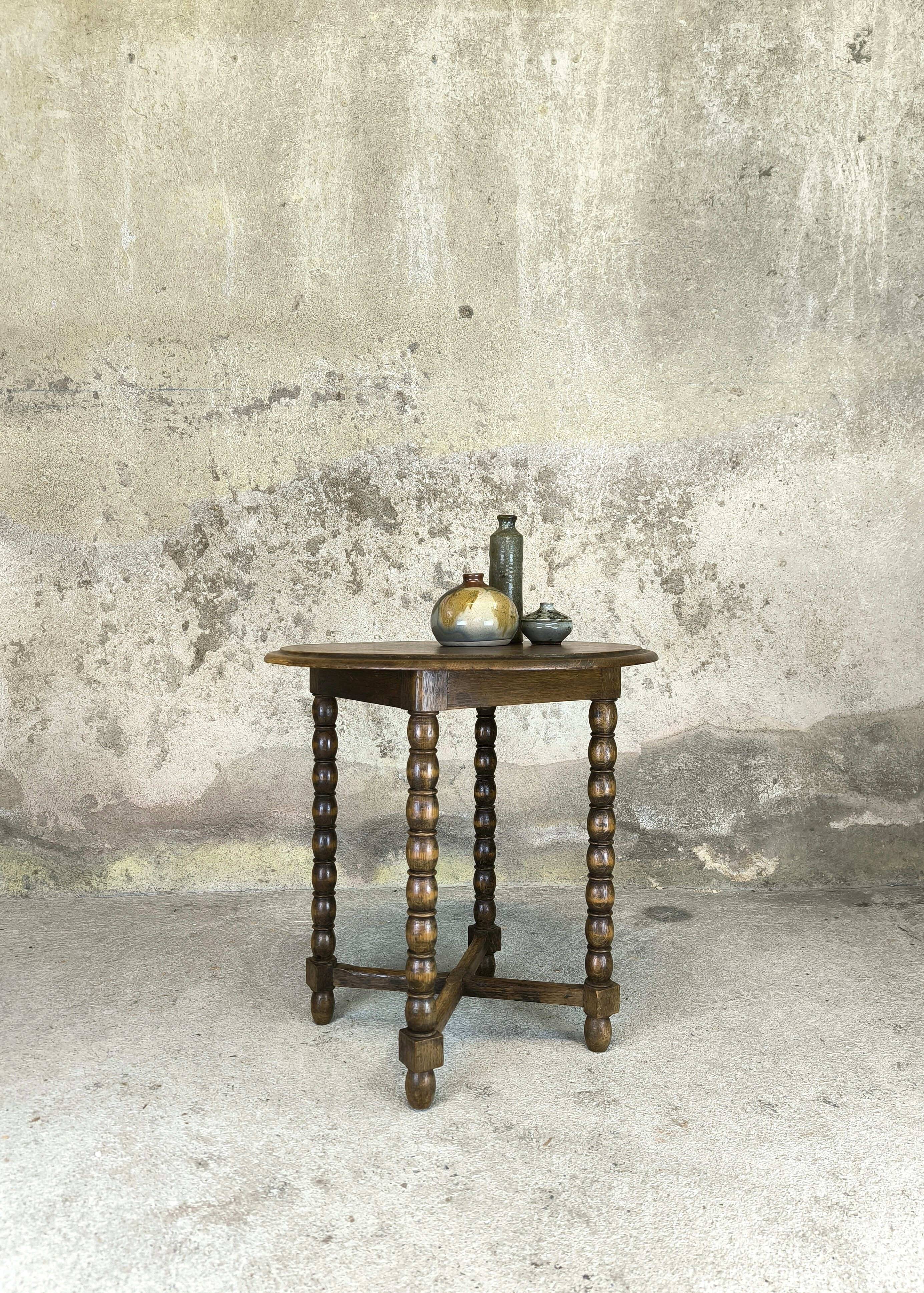 Vintage gueridon with beaded wooden legs.