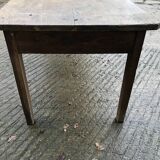 Antique farmhouse table in solid oak with tapered legs and 1 drawer at the end.