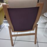 Relaxing armchair and its Scandinavian footrest