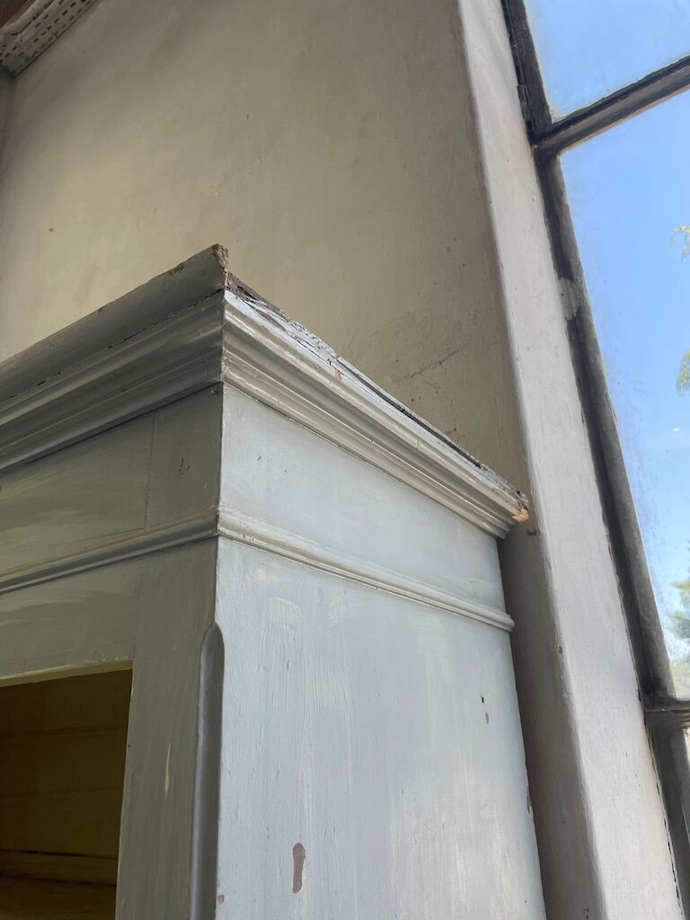 Blue patinated cap cabinet