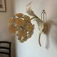 Ecru metal flower wall sconce