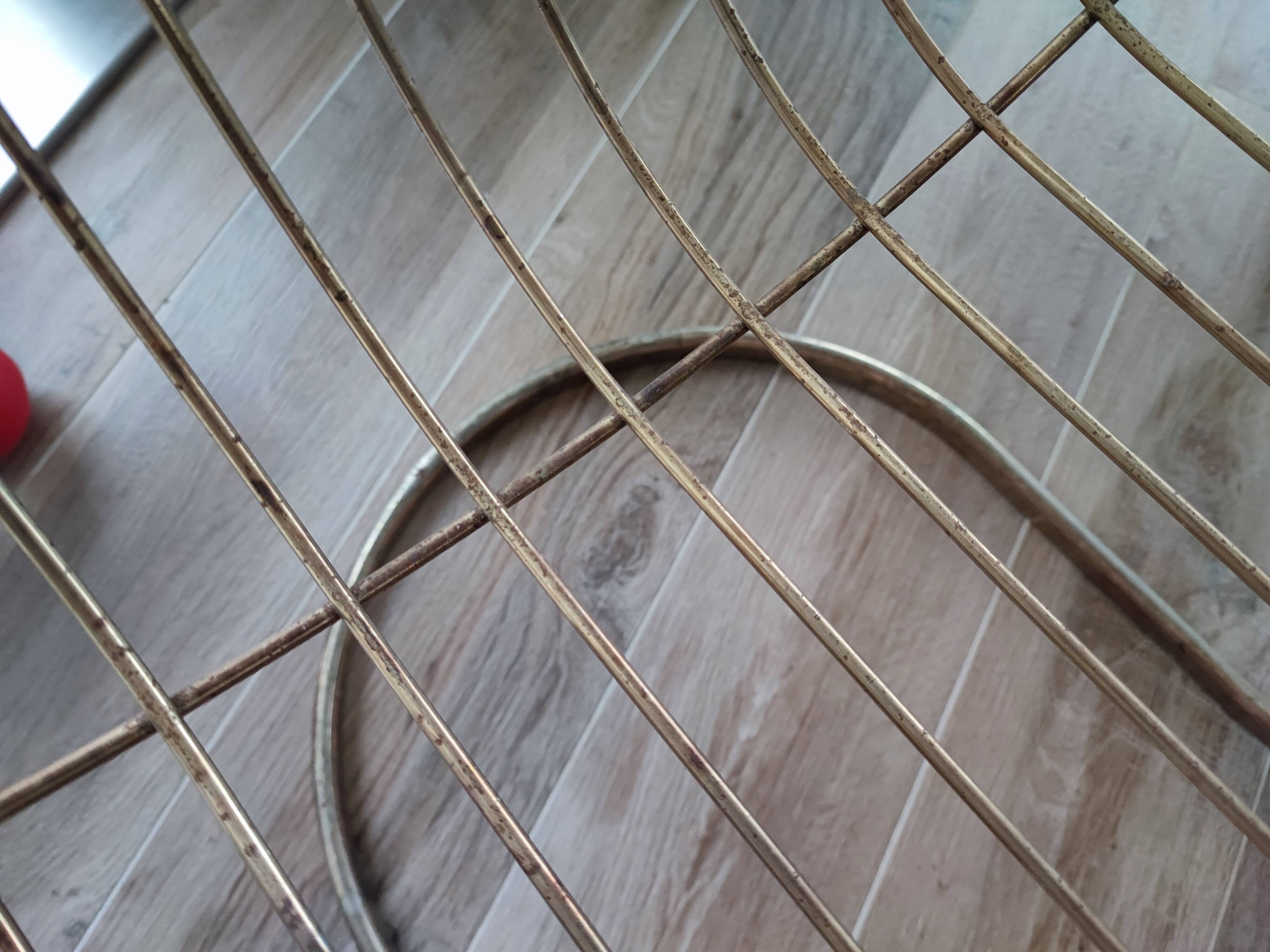 Tubular metal chair covered with gilding