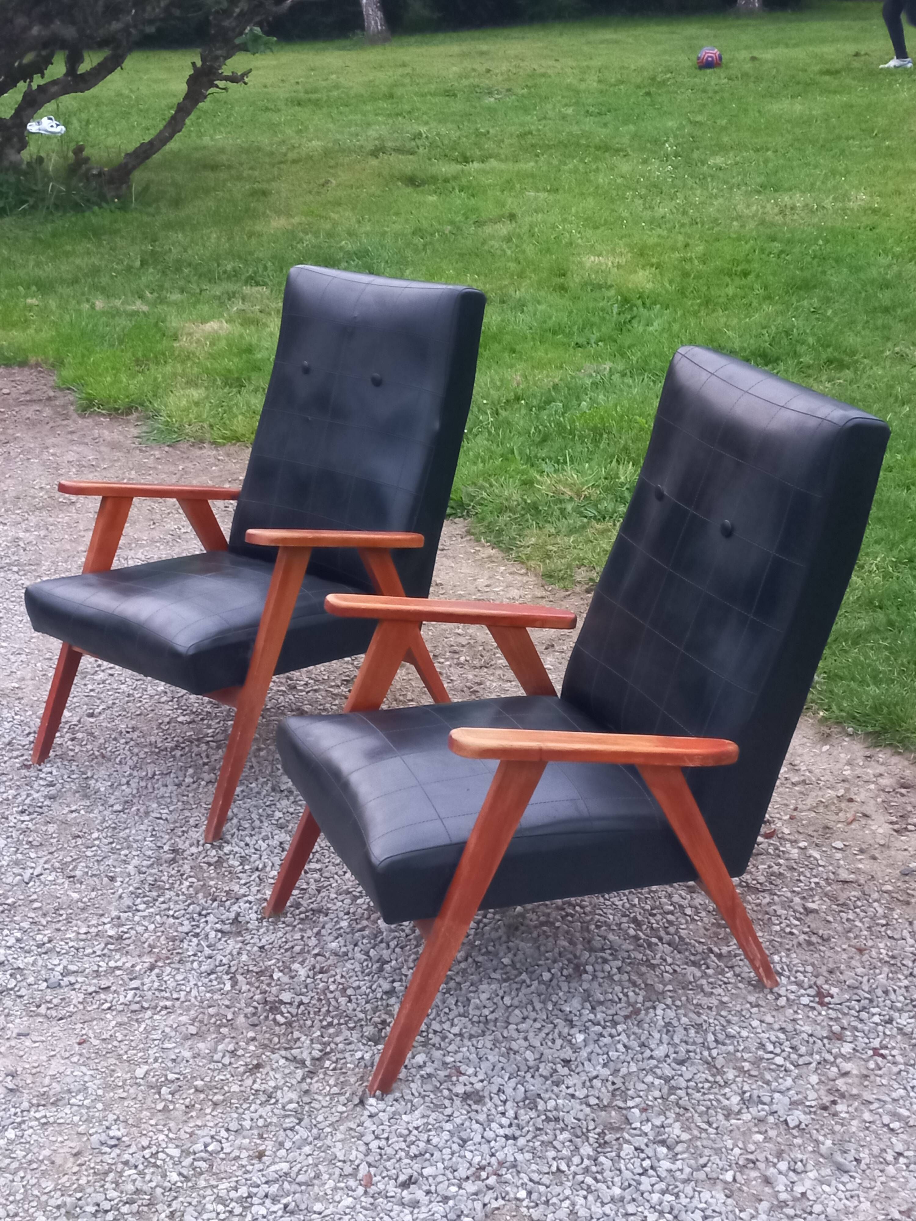 Pair of vintage beech armchairs feet compass covered with black moleskine from the 50s