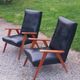 Pair of vintage beech armchairs feet compass covered with black moleskine from the 50s
