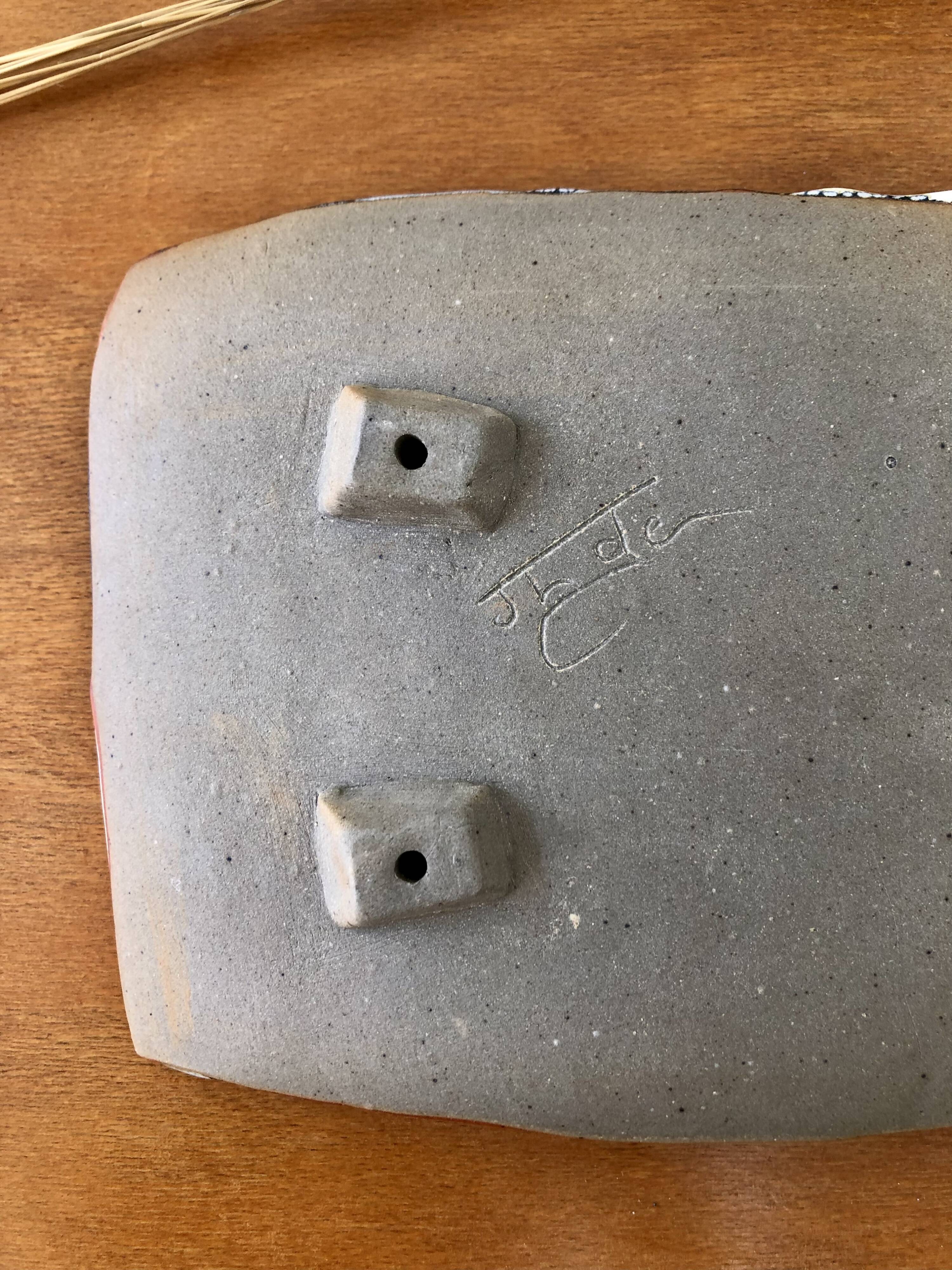 Cup in enamelled sandstone signed