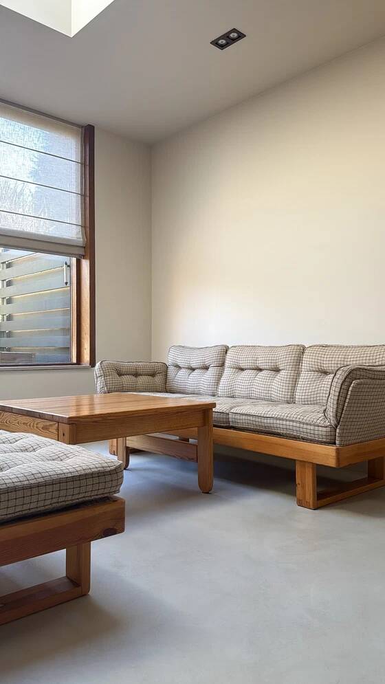 Two vintage Swedish sofas and a pine table