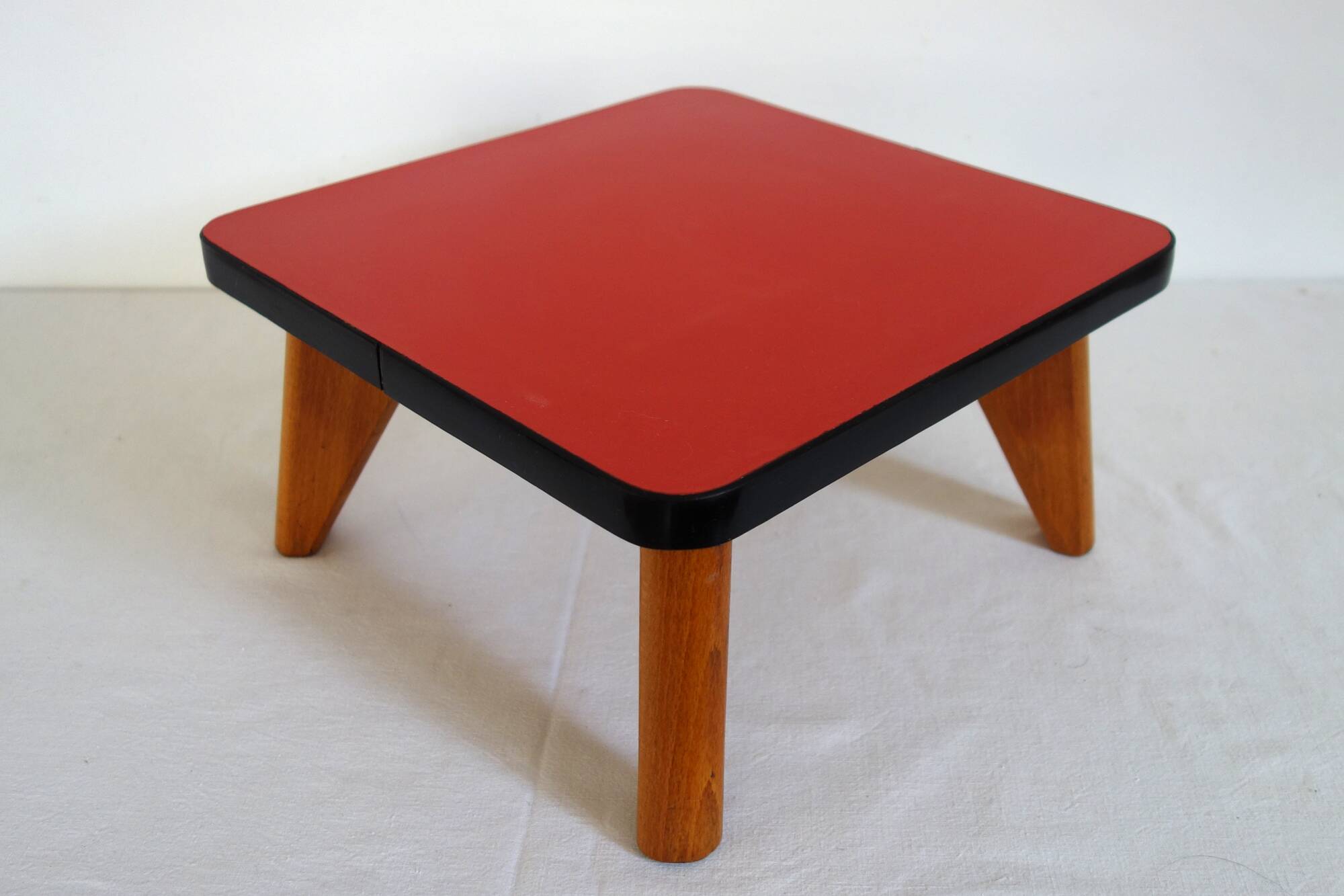 Mini vintage red formica pedestal table or stool