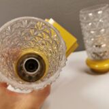 Bathroom lamps in a nice yellow colour with a crystal glass shade and a base of hard thin plastic
