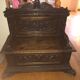 Solid wood chest, carved, with backrest, feet and armrests