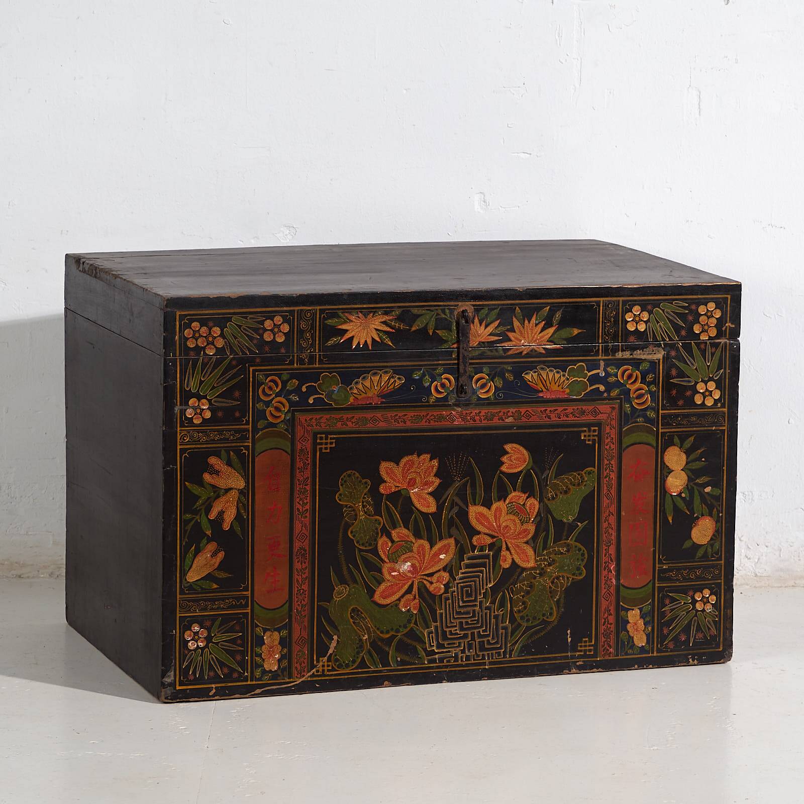 Antique wooden chest with lotus flower illustrations (China, circa 1900)