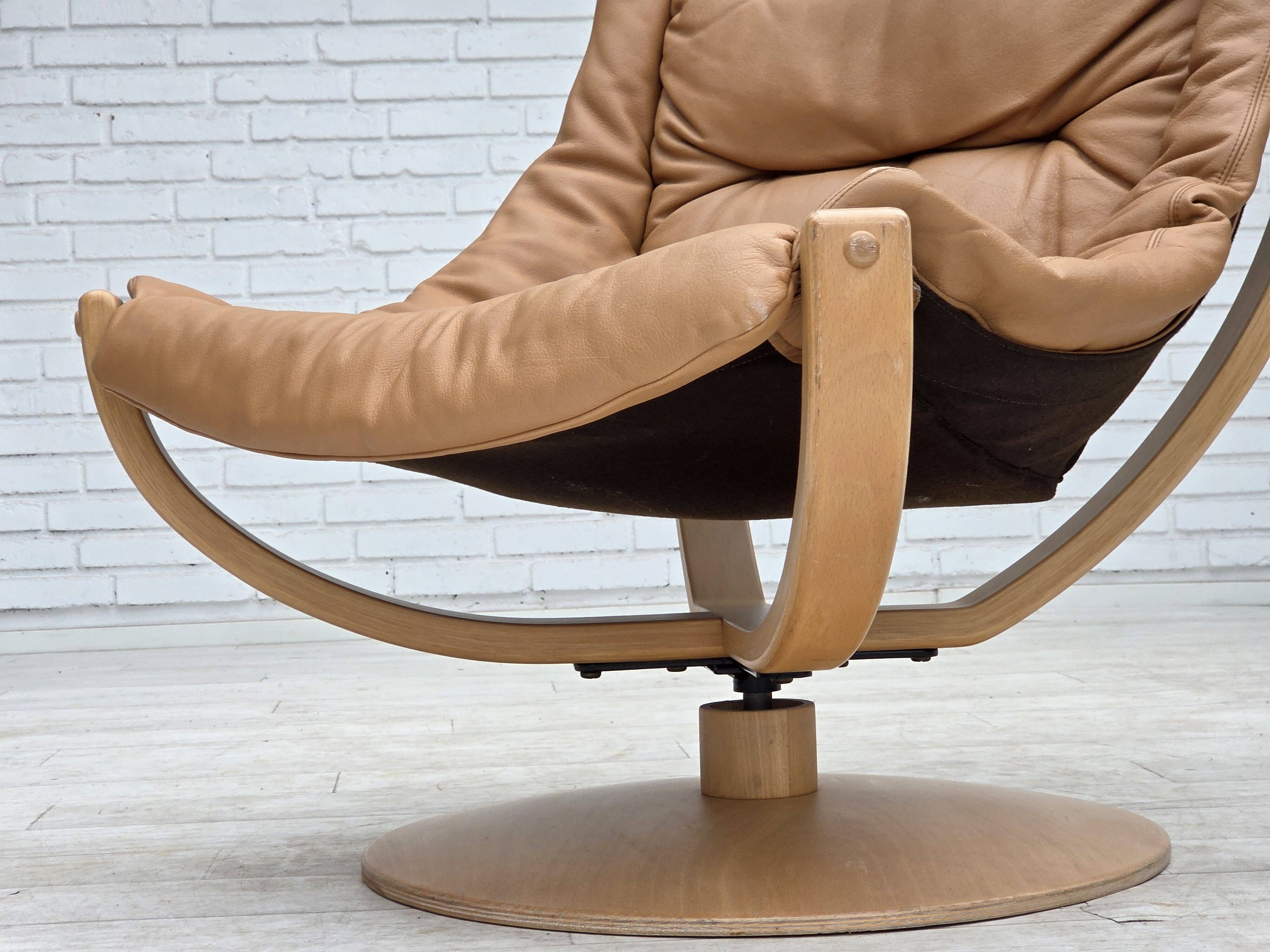 1980s, Scandinavian swivel armchair, furniture leather, bent wood.