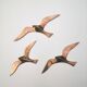 Oiseaux stylisés en laiton