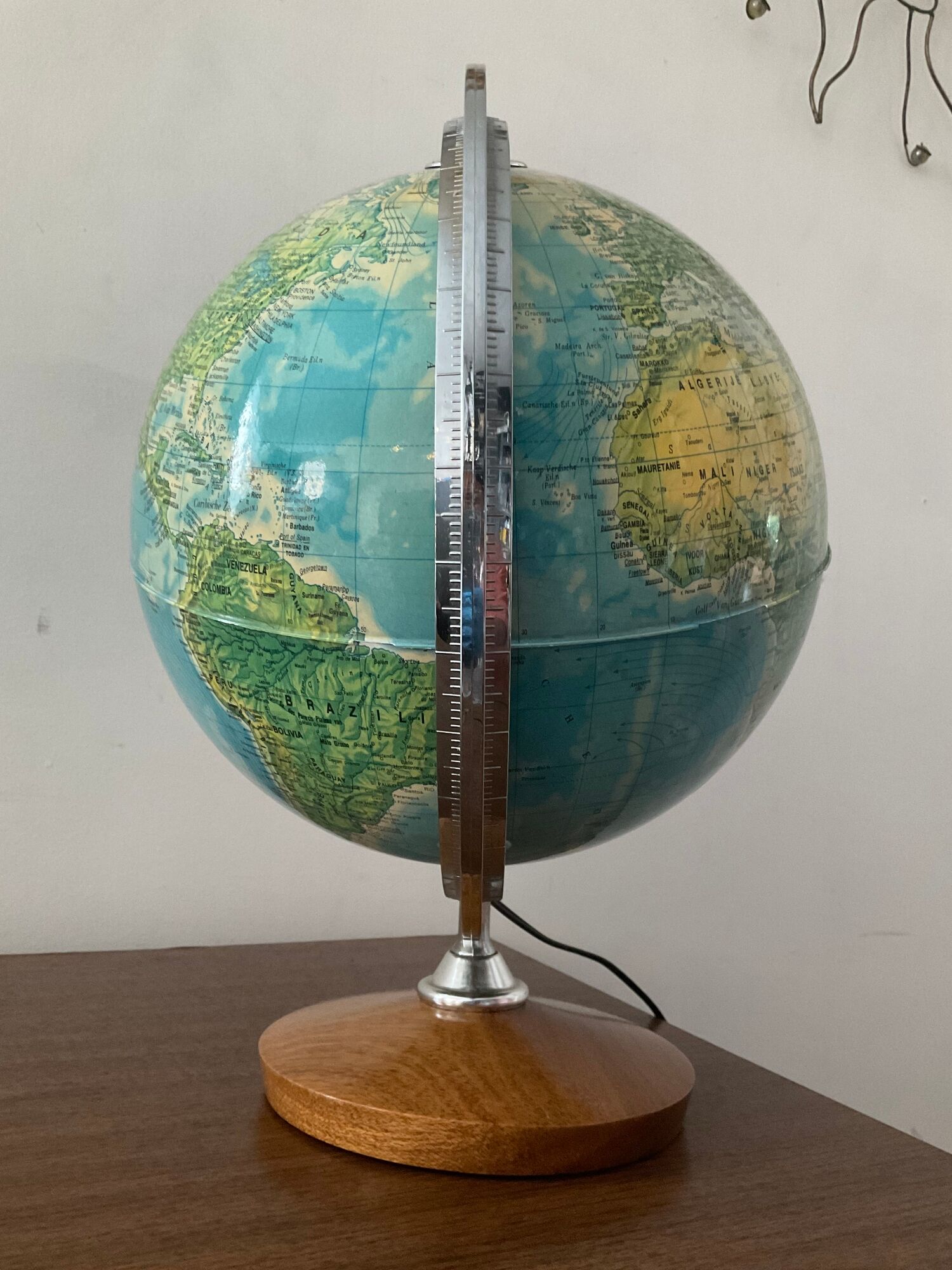 Bright vintage world map with wooden foot