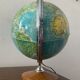 Bright vintage world map with wooden foot