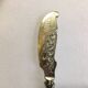Silver-plated cheese knife with finely chiseled blade, 1900s