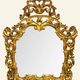 Antique wall mirror in carved and gilded wood, baroque style, 140 × 115 cm