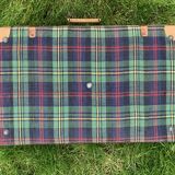 Old large suitcase in leather and tartan fabric