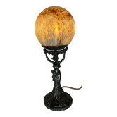 Lamp with foot shape of sculpture of woman finish ball in glass paste to effect