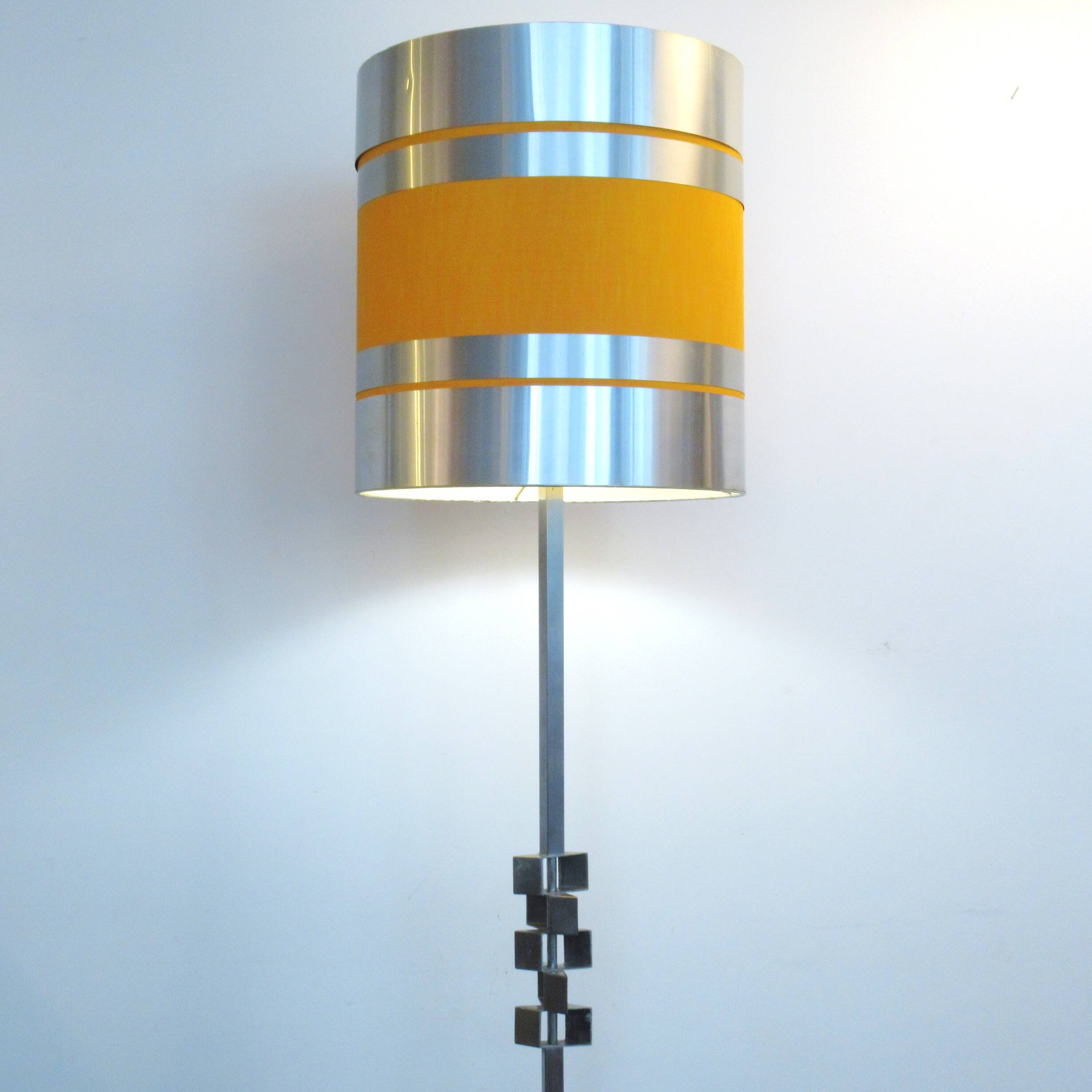 Floor lamp with a large orange shade and metal from the 1960s.