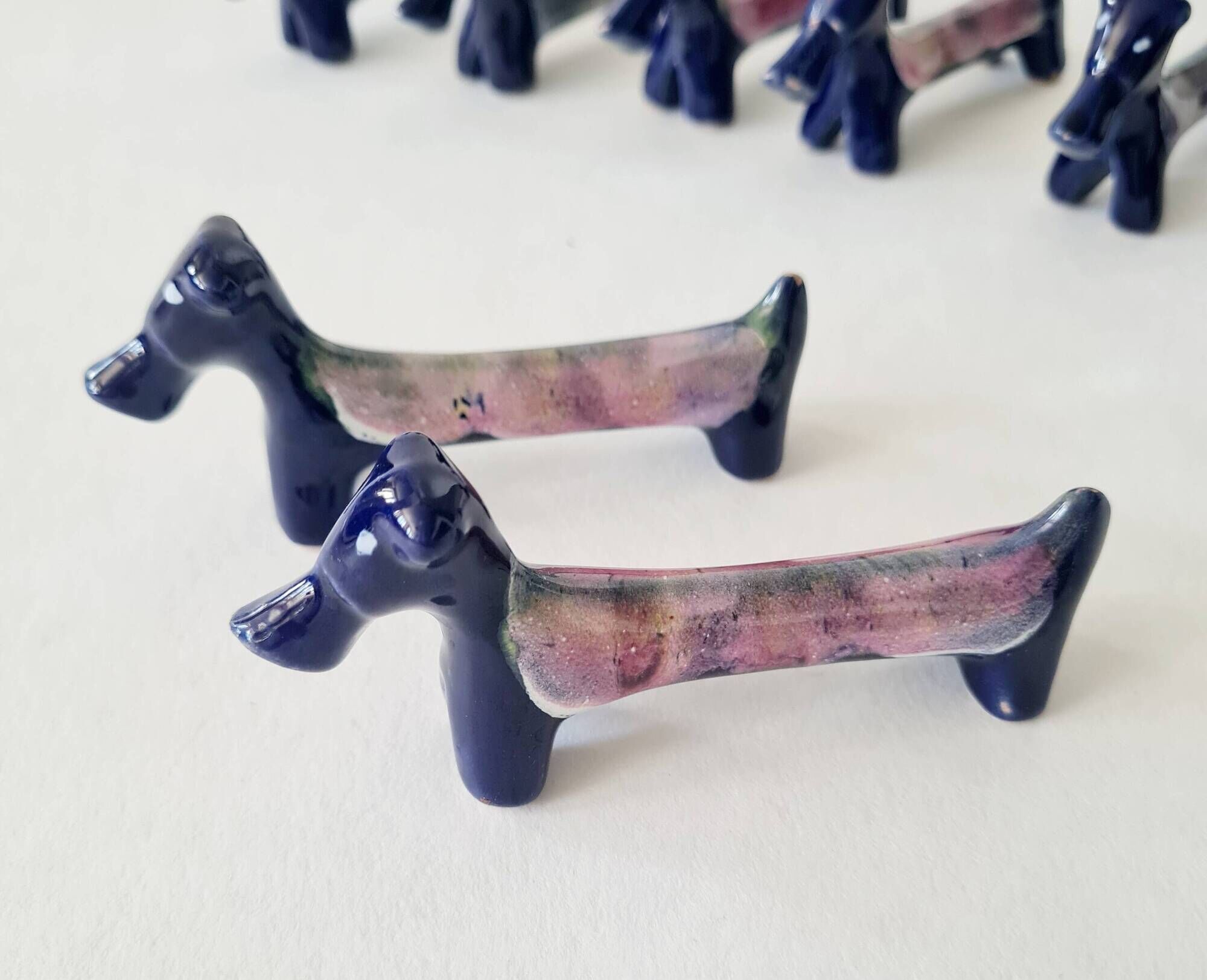 Set of 8 vintage ceramic knife rests, retro dog design.