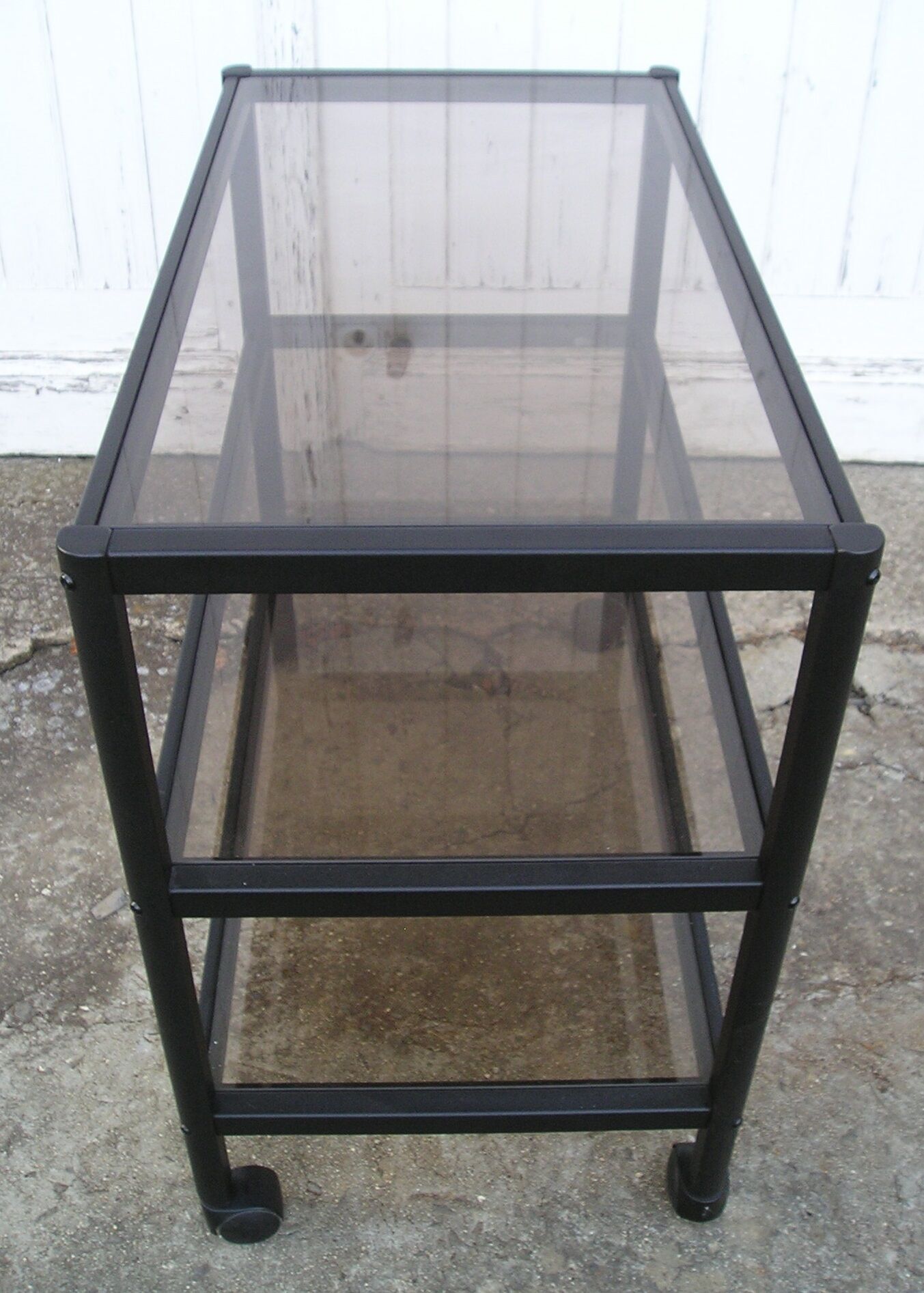 Rolling table serves 3 trays of smoked glass