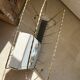 Vintage gold metal magazine rack from the 1960s.
