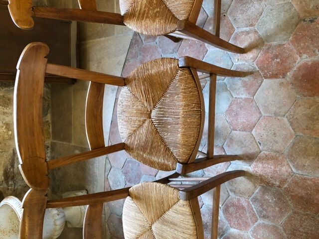 Solid oak table with 3 extension cords, 6 oak chairs with straw seat