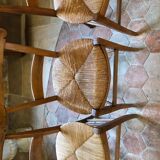 Solid oak table with 3 extension cords, 6 oak chairs with straw seat