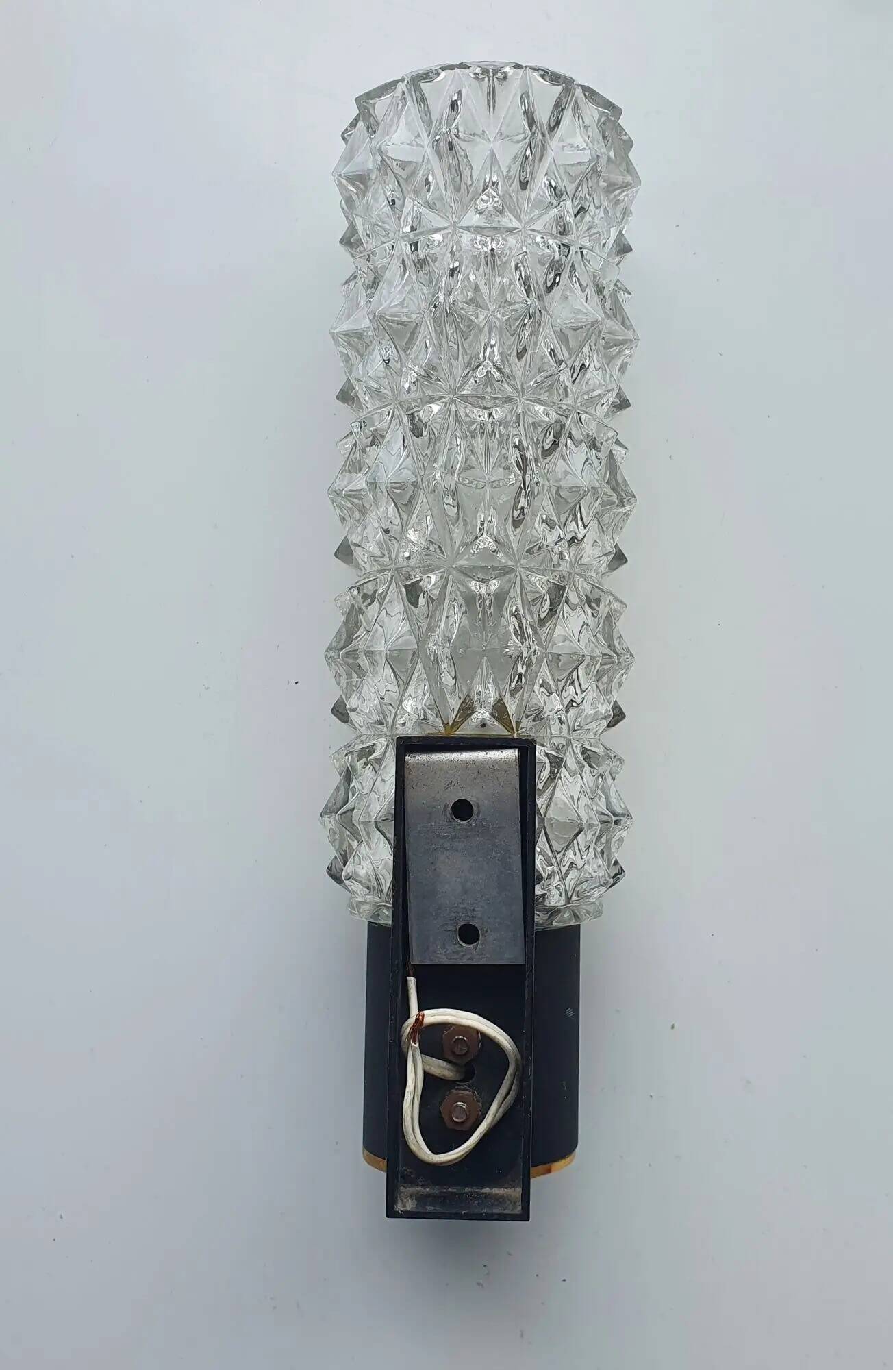 Black wall light with structured glass in Arlus style