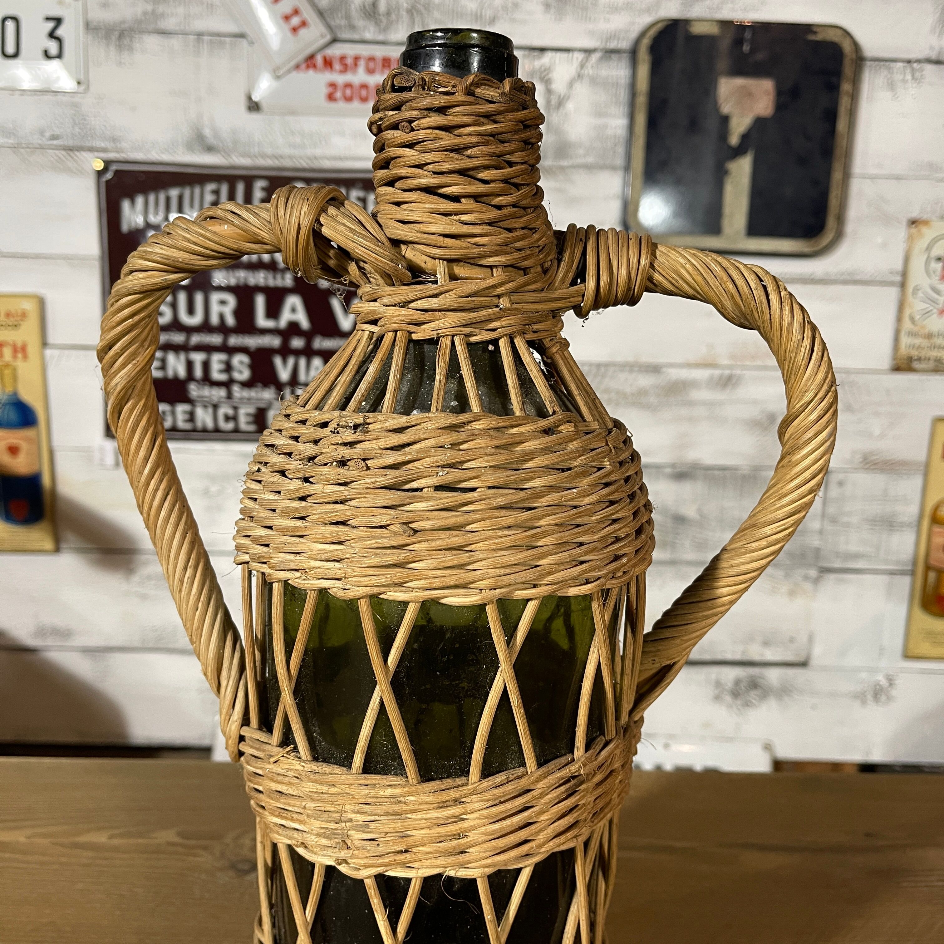 Braided wicker green bottle