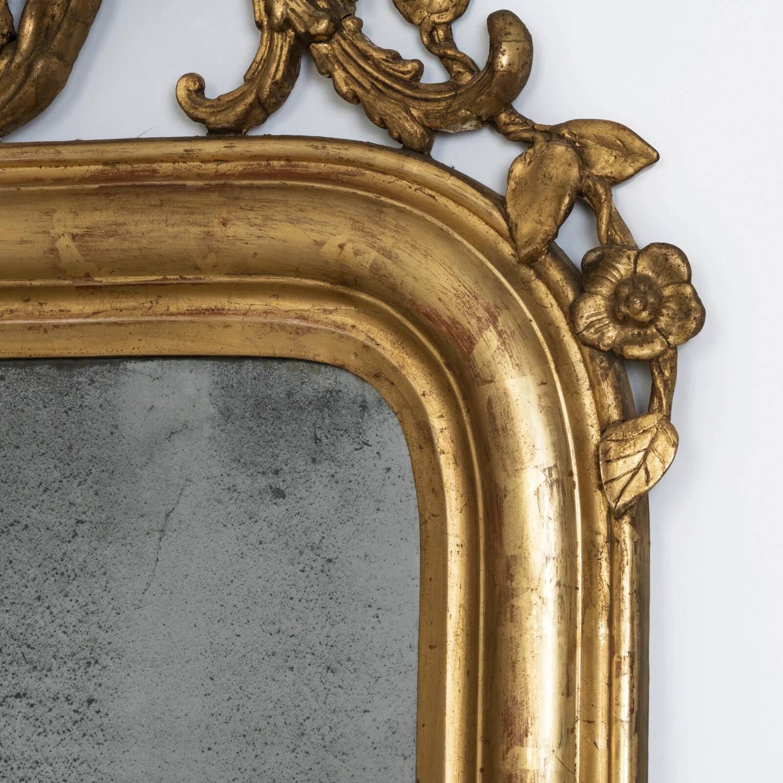Louis-Philippe mirror from the 19th century with foliage and grape cluster motifs.